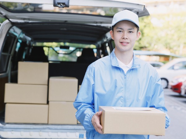 Pharmacist assisting customer at modern pharmacy counter